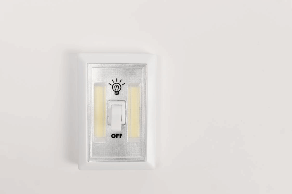 Light switch turned off to cut hidden energy costs from home appliances.