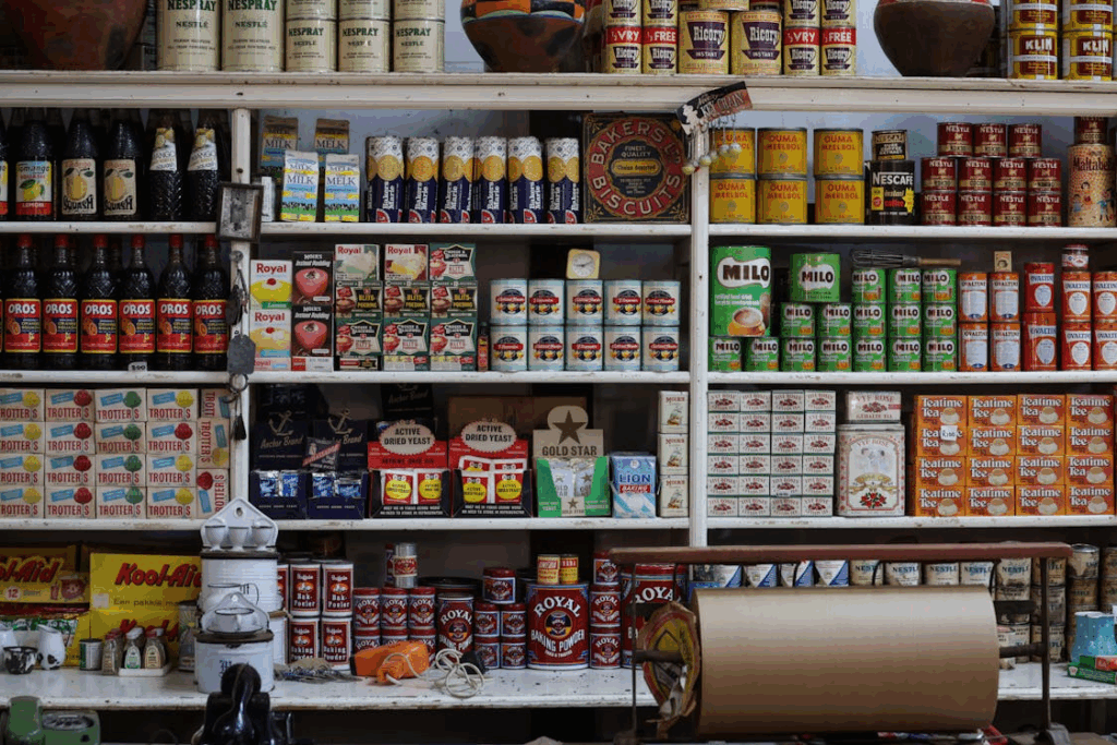 Pantry shelves filled with canned goods and packaged foods, illustrating long shelf life beyond Best By dates.