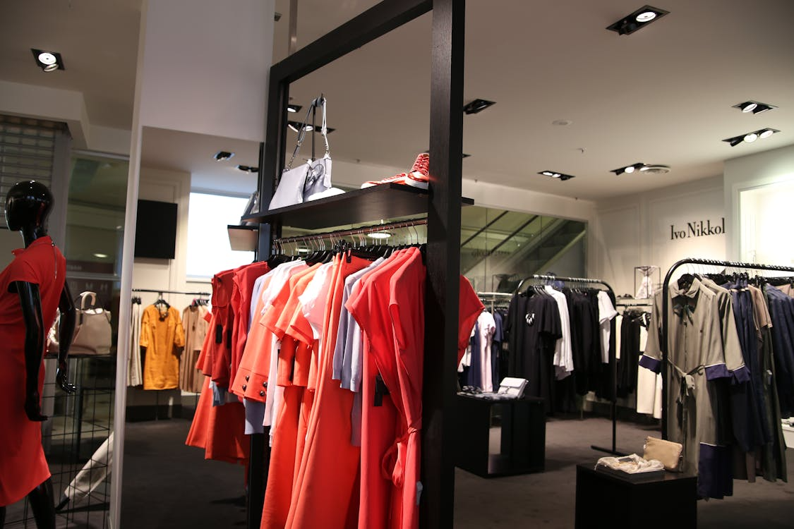 Retail clothing store with spotlighted displays showing how strategic lighting influences shopper perception.